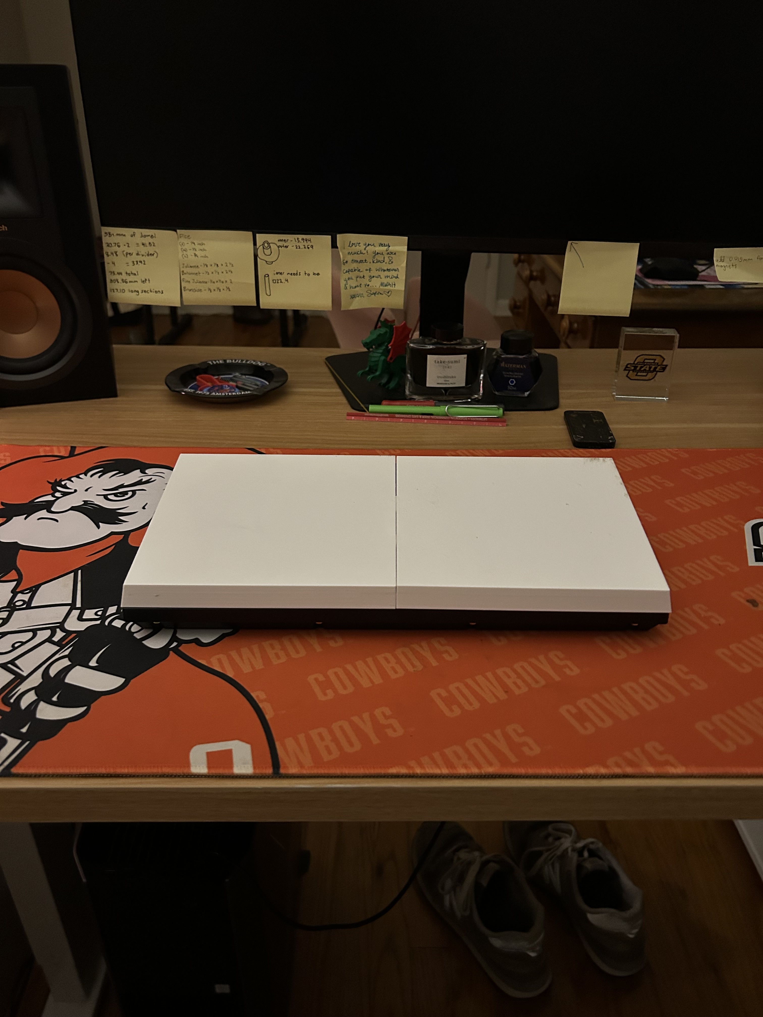 The two cover halves snapped together into a single closed block, off the keyboard
