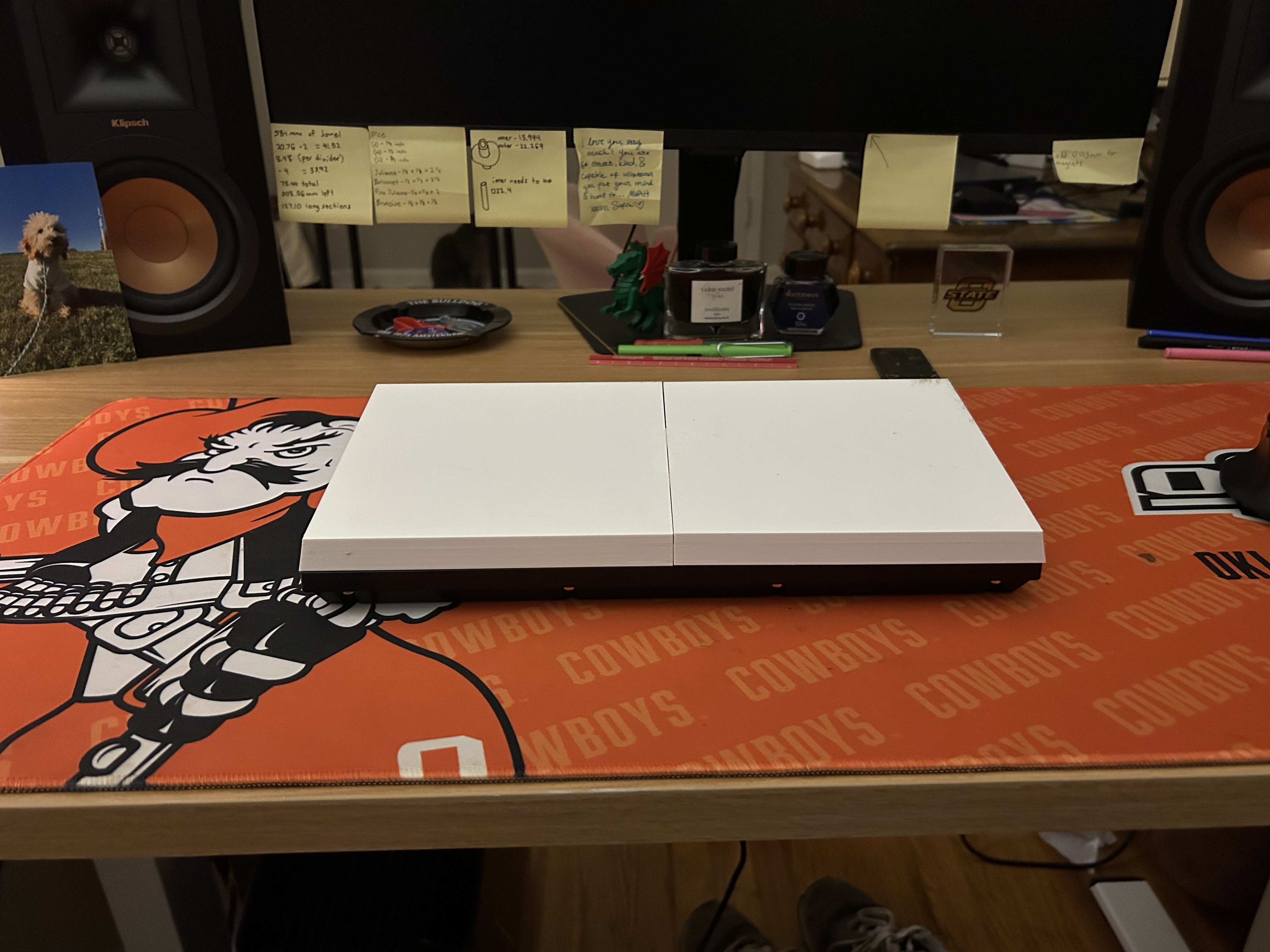Side angle of the closed keyboard cover sitting on the desk