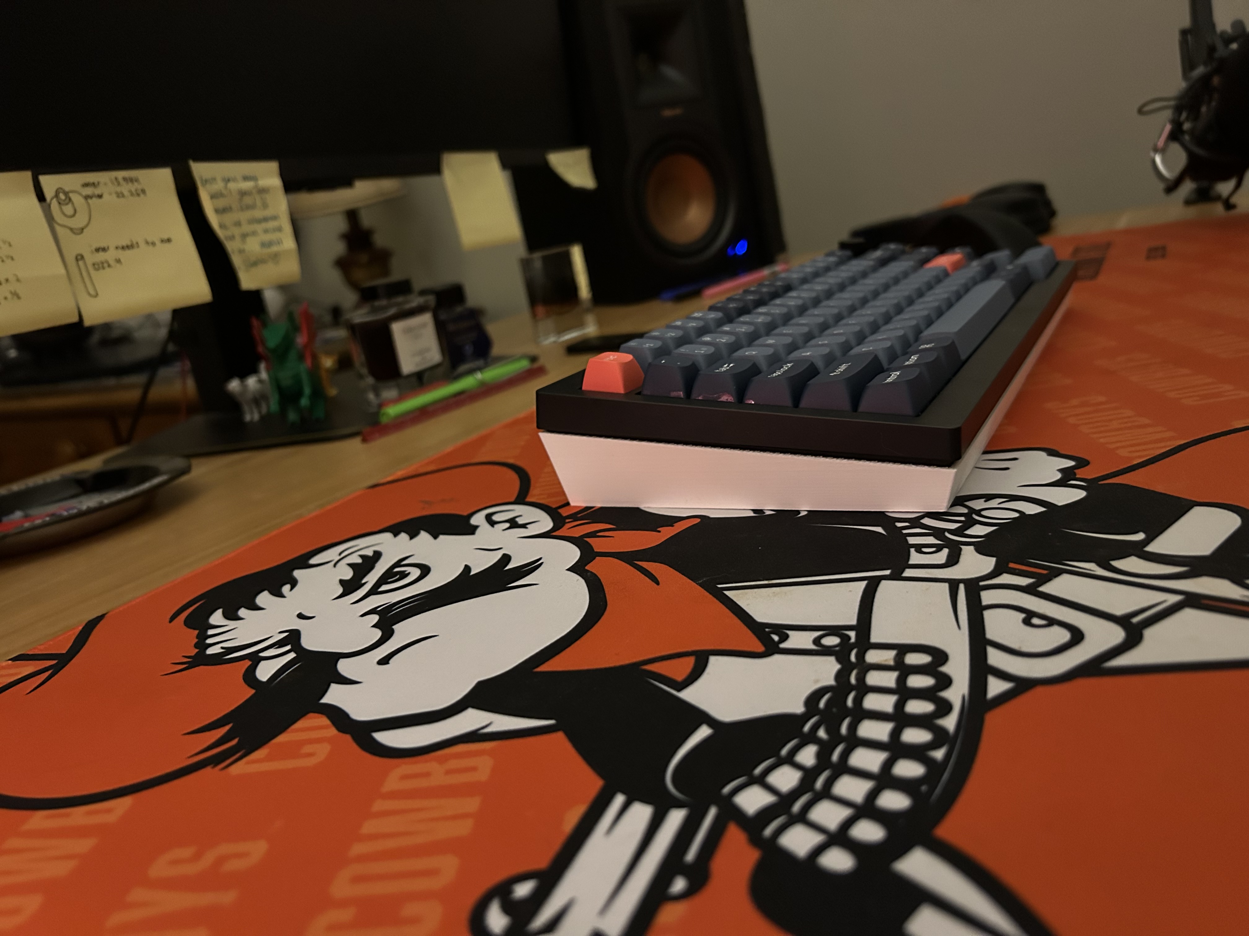 The keyboard resting on the two cover halves tucked underneath it, tilted up slightly for typing